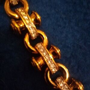 Rose gold and rhinestone  fashion bracelet, with multicolored stones on the side